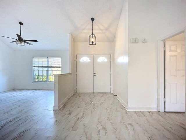 1005 Cameo Crest Ln, Valrico, FL 33596 - foyer entrance with a ceiling fan, light marble finish floors, and baseboards
