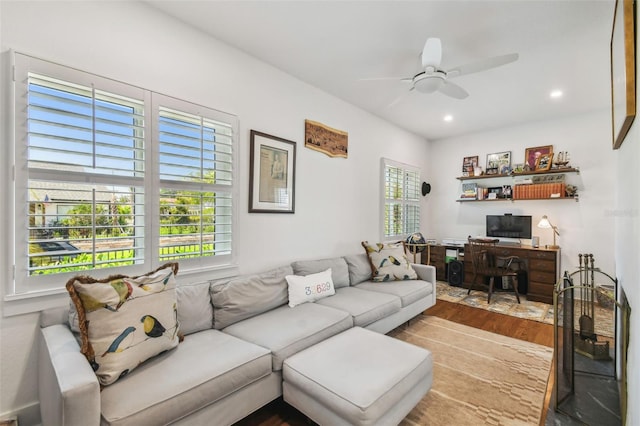 living room featuring a ceiling fan, recessed lighting, and wood finished floors