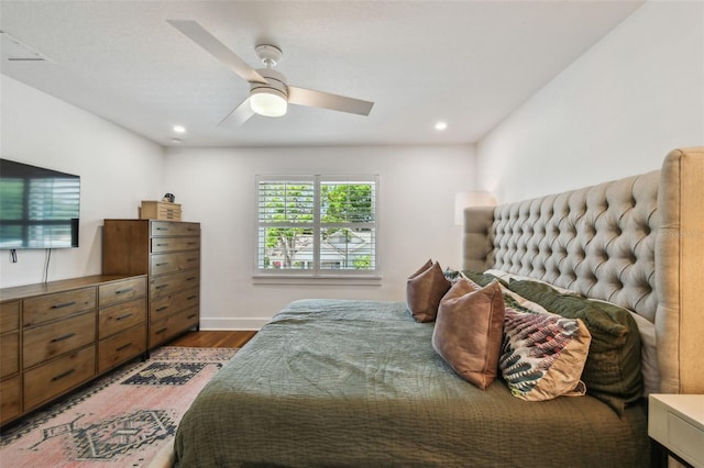 bedroom with recessed lighting, a ceiling fan, and wood finished floors