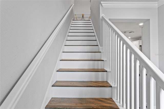 staircase with ornamental molding