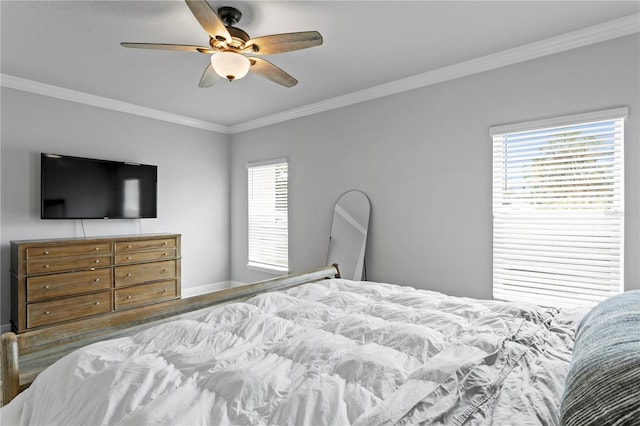 bedroom featuring crown molding, baseboards, multiple windows, and ceiling fan
