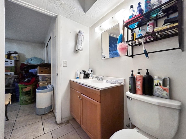 half bathroom featuring tile patterned floors, vanity, and toilet