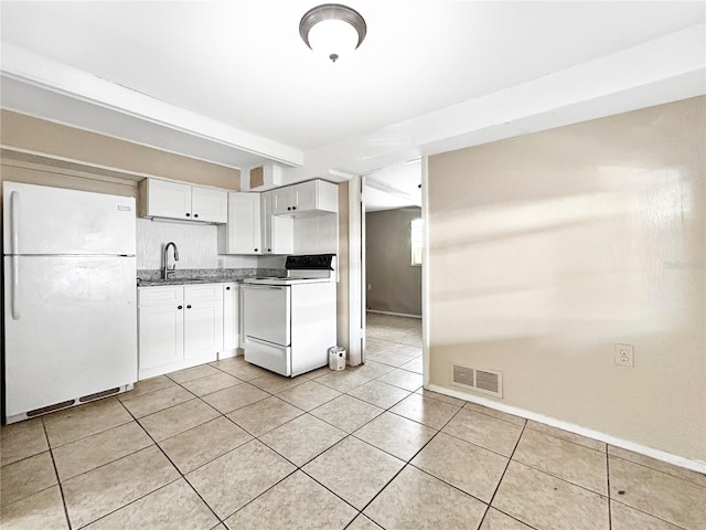 kitchen with visible vents, white appliances, white cabinets, a sink, and light tile patterned floors