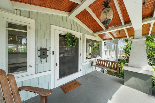 doorway to property featuring a porch