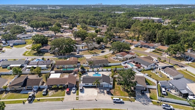 aerial view with a residential view and a wooded view