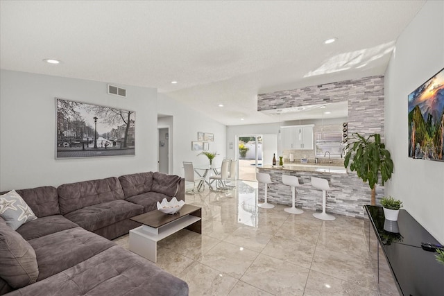 living room featuring recessed lighting, visible vents, and marble finish floor