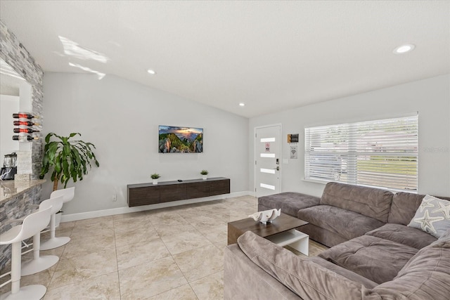 living room with recessed lighting, baseboards, light tile patterned floors, and vaulted ceiling