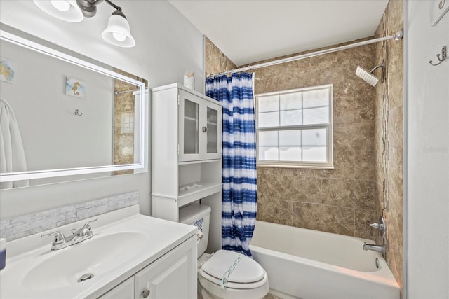 full bath with vanity, shower / tub combo with curtain, and toilet