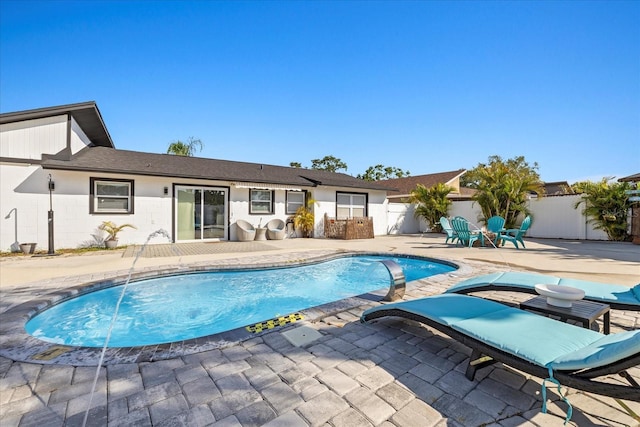 view of pool featuring a fenced backyard, a fenced in pool, and a patio