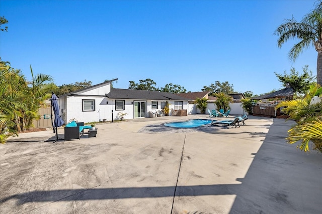 view of swimming pool with fence, a fenced in pool, and a patio