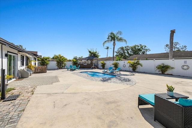view of pool with a patio, a fenced backyard, and a fenced in pool