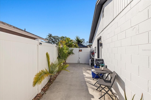 view of patio / terrace with fence and a gate
