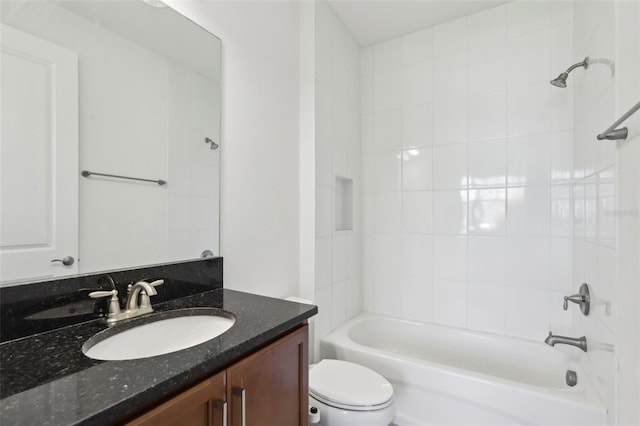 full bathroom featuring vanity, bathing tub / shower combination, and toilet