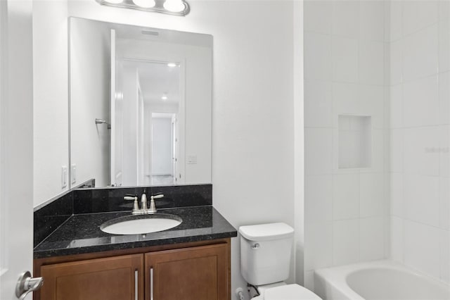 bathroom with vanity, visible vents, and toilet