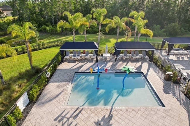 pool with fence, a gazebo, a lawn, and a patio area