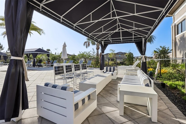 view of patio with a gazebo and fence