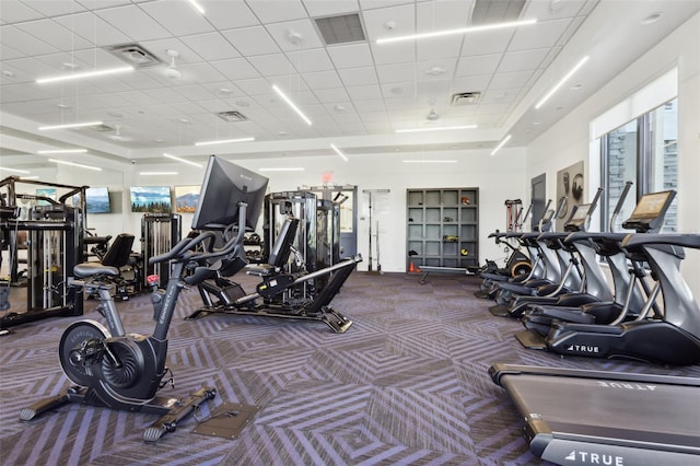 exercise room featuring visible vents and carpet