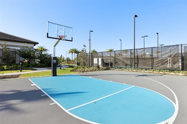 view of basketball court with fence and community basketball court