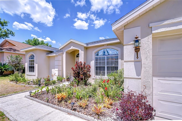 doorway to property with stucco siding