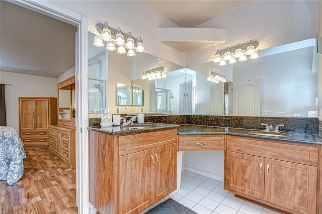 full bathroom featuring vanity and tile patterned flooring