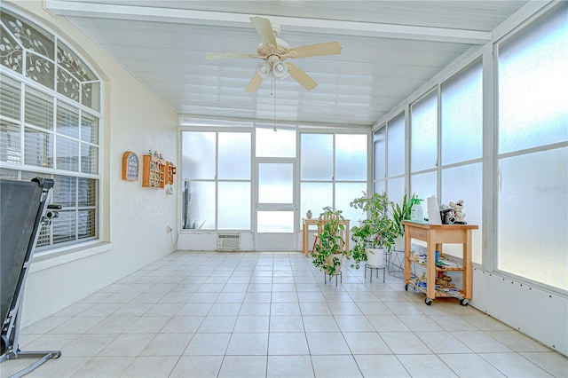 sunroom with tile patterned floors and an AC wall unit