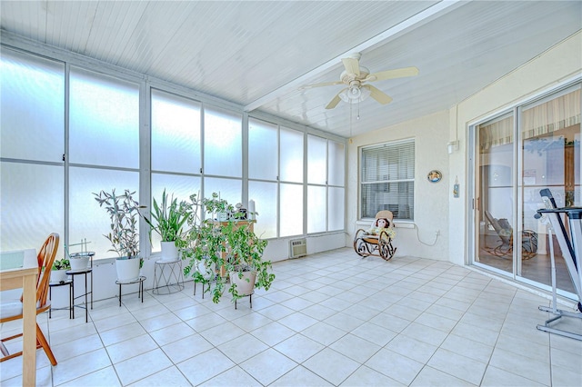 sunroom / solarium with a wall unit AC and tile patterned flooring