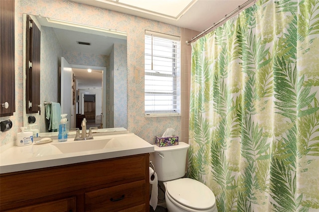64 Sj Kellner Blvd, Beverly Hills, FL 34465 - full bathroom with wallpapered walls, toilet, healthy amount of natural light, vanity, and a shower with curtain