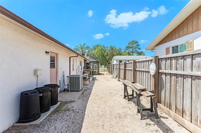 64 Sj Kellner Blvd, Beverly Hills, FL 34465 - view of yard featuring fence and central AC