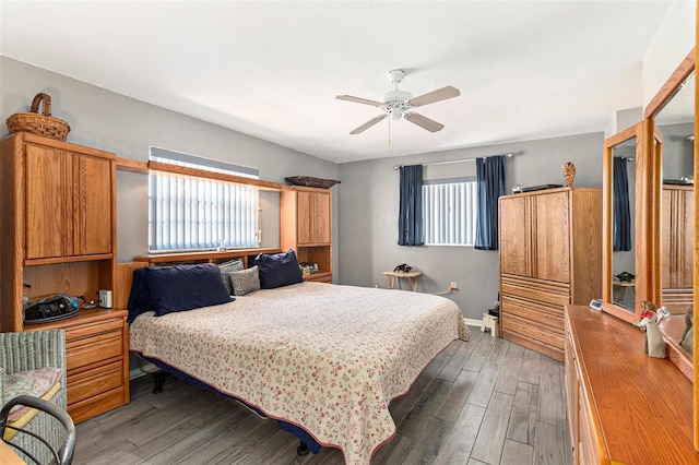 64 Sj Kellner Blvd, Beverly Hills, FL 34465 - bedroom featuring multiple windows, wood finished floors, baseboards, and a ceiling fan