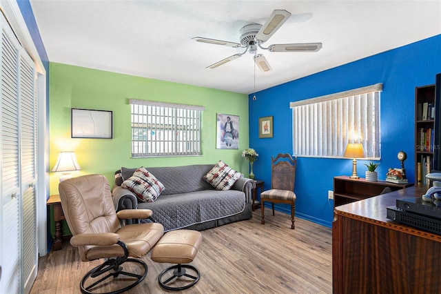 64 Sj Kellner Blvd, Beverly Hills, FL 34465 - living room with wood finished floors, a ceiling fan, and baseboards