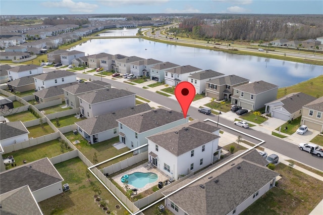 bird's eye view featuring a water view and a residential view