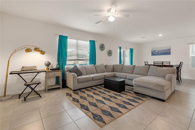 living area featuring light tile patterned floors, visible vents, ceiling fan, and recessed lighting