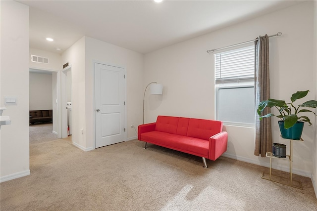 sitting room with baseboards, recessed lighting, visible vents, and carpet floors