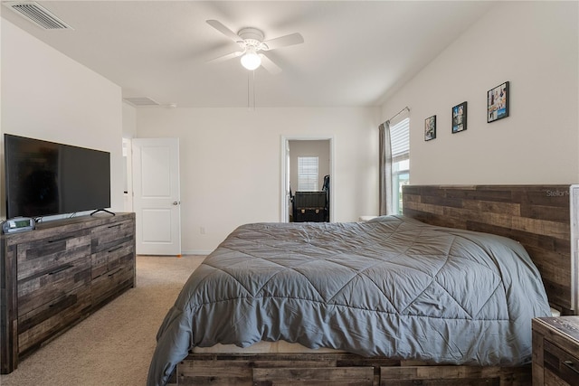 carpeted bedroom featuring visible vents, baseboards, and a ceiling fan