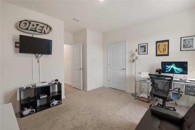 carpeted home office featuring baseboards and visible vents