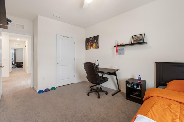 carpeted bedroom featuring baseboards and visible vents