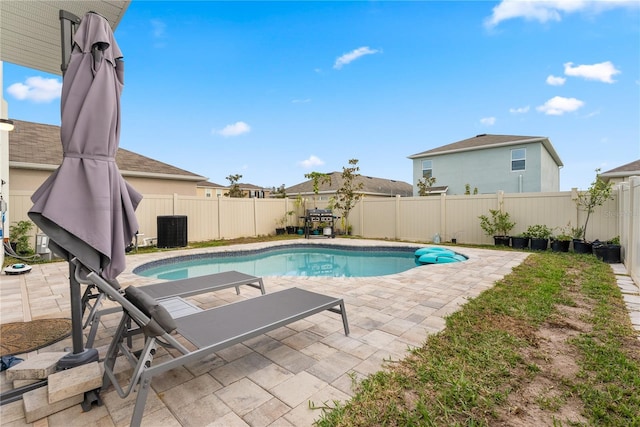 view of pool featuring central air condition unit, a patio, a fenced backyard, and a fenced in pool