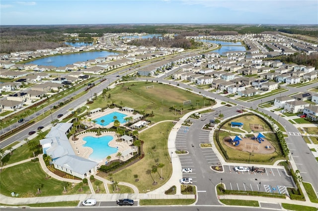 aerial view with a water view and a residential view