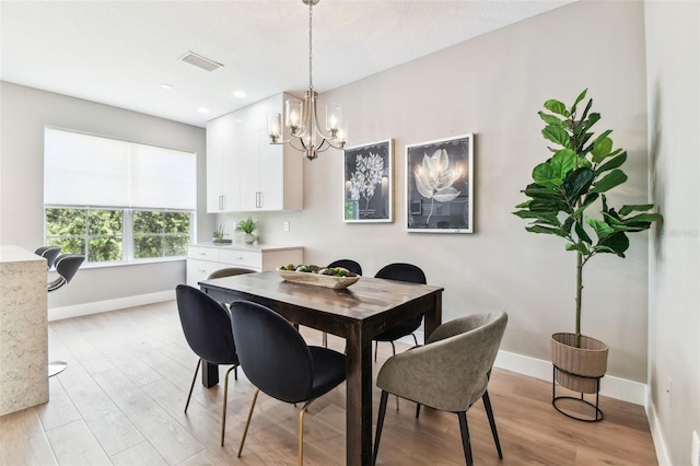 2547 Lexington Oak Dr, Brandon, FL 33511 - dining space with light wood-type flooring, baseboards, a chandelier, and recessed lighting