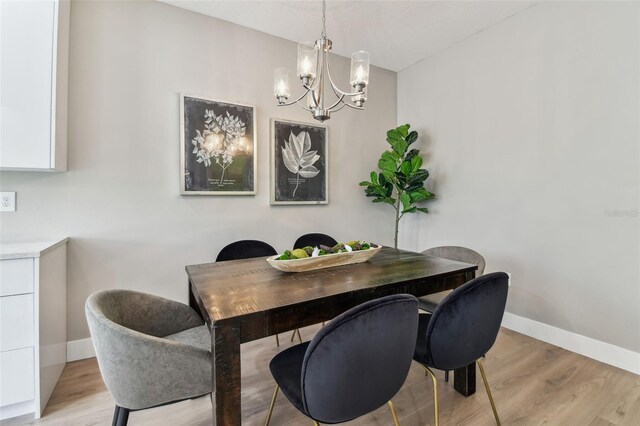 2547 Lexington Oak Dr, Brandon, FL 33511 - dining area with a chandelier, light wood-style flooring, and baseboards