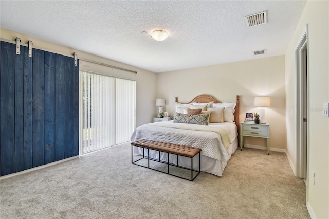2547 Lexington Oak Dr, Brandon, FL 33511 - bedroom featuring carpet flooring, a textured ceiling, and baseboards
