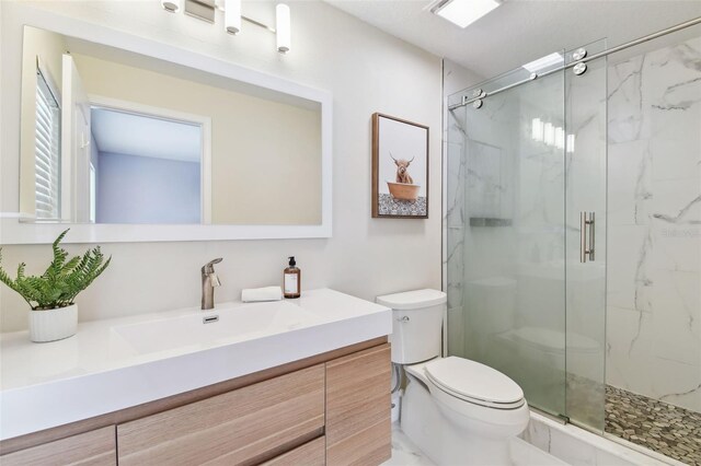 2547 Lexington Oak Dr, Brandon, FL 33511 - full bathroom with toilet, a marble finish shower, and vanity