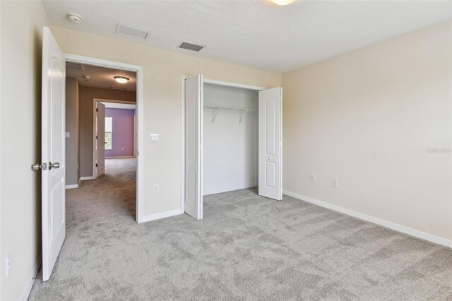 2547 Lexington Oak Dr, Brandon, FL 33511 - unfurnished bedroom with carpet floors, baseboards, and a closet
