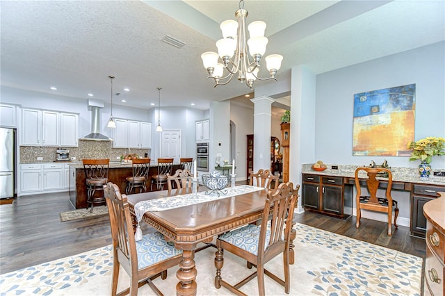 dining space featuring recessed lighting, ornate columns, dark wood-style flooring, and visible vents