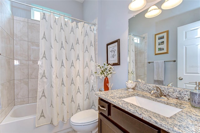 full bath with vanity, toilet, and shower / tub combo with curtain