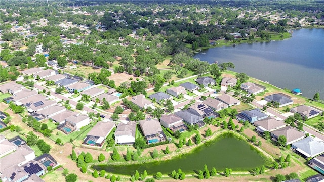 bird's eye view with a water view and a residential view