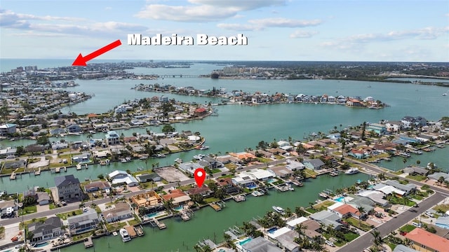 drone / aerial view featuring a water view and a residential view