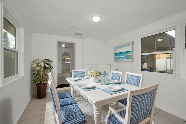 306 S Highland Ave, Clearwater, FL 33755 - dining room featuring baseboards and light tile patterned floors