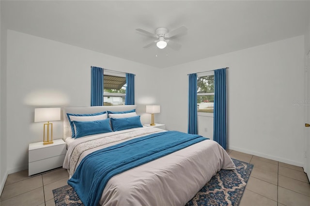 306 S Highland Ave, Clearwater, FL 33755 - tiled bedroom with multiple windows, baseboards, and ceiling fan