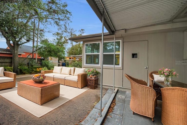 306 S Highland Ave, Clearwater, FL 33755 - view of patio with an outdoor hangout area, fence, and outdoor dining space
